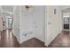Inviting entryway with a built-in bench, coat rack, and convenient access to the front door at 2835 Berkhamstead Cir, Concord, NC 28027
