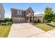 Lovely two-story home with a two-car garage, mature landscaping, and a welcoming front porch at 2835 Berkhamstead Cir, Concord, NC 28027