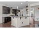Well-equipped kitchen featuring granite countertops, stainless steel appliances, and stylish dark cabinetry at 2835 Berkhamstead Cir, Concord, NC 28027