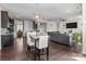 Open concept living space with kitchen, dining area, and comfortable seating area at 2835 Berkhamstead Cir, Concord, NC 28027
