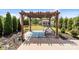 Covered pergola with decorative swing in backyard of well-maintained home at 2835 Berkhamstead Cir, Concord, NC 28027