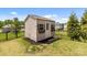 Charming backyard shed with flower boxes, secure fence, and ample storage space for outdoor tools and equipment at 2835 Berkhamstead Cir, Concord, NC 28027