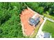 Aerial view of new construction home on a large lot surrounded by mature trees at 3078 Mountain Creek Dr, Sherrills Ford, NC 28673