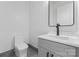 Bathroom featuring sink and vanity, black hardware, and modern toilet at 3078 Mountain Creek Dr, Sherrills Ford, NC 28673