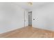 Neutral bedroom with hardwood floors, a ceiling fan and a large window offering natural light at 3078 Mountain Creek Dr, Sherrills Ford, NC 28673