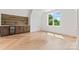 Bright bonus room featuring wood floors, beverage bar, cabinetry and a large window at 3078 Mountain Creek Dr, Sherrills Ford, NC 28673