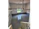 View of the spacious garage with a window, painted floor, and painted walls, providing a clean and well-lit space at 3078 Mountain Creek Dr, Sherrills Ford, NC 28673