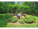 Community entrance sign with beautifully manicured landscaping, including shrubs, flowers and trees at 3078 Mountain Creek Dr, Sherrills Ford, NC 28673