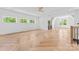 Spacious open-concept living room featuring hardwood floors and multiple windows at 3078 Mountain Creek Dr, Sherrills Ford, NC 28673