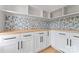 Pantry featuring white cabinets, drawers, tile backsplash, and a wood countertop at 3078 Mountain Creek Dr, Sherrills Ford, NC 28673