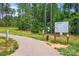 Paved path leading to a park with signage and lush green trees at 3078 Mountain Creek Dr, Sherrills Ford, NC 28673