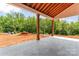Spacious covered patio with tiled flooring and wooden beams, perfect for outdoor relaxation and entertaining at 3078 Mountain Creek Dr, Sherrills Ford, NC 28673
