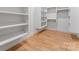 Spacious walk-in closet with hardwood floors, built-in shelving and hanging storage, great for organization at 3078 Mountain Creek Dr, Sherrills Ford, NC 28673