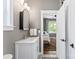 Well-lit bathroom leading into a bedroom, featuring modern fixtures at 314 Center Dr, Davidson, NC 28036