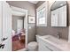 Bathroom with a white vanity, toilet, and shower located off a bedroom at 314 Center Dr, Davidson, NC 28036