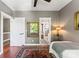 Bedroom with ensuite bathroom featuring hardwood floors and a colorful rug at 314 Center Dr, Davidson, NC 28036