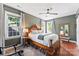 Traditional bedroom with wood floors, king bed, overhead fan and patterned drapes and rug at 314 Center Dr, Davidson, NC 28036
