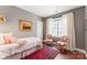 Inviting bedroom with neutral walls, arm chairs, and hardwood flooring at 314 Center Dr, Davidson, NC 28036