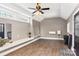 Open bonus room with lots of natural light, wood flooring, and a modern ceiling fan at 314 Center Dr, Davidson, NC 28036