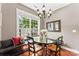 Charming dining area with a window seat, chandelier, and natural light at 314 Center Dr, Davidson, NC 28036