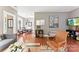 Open-concept living room with hardwood floors, cozy seating, and view into the dining area at 314 Center Dr, Davidson, NC 28036