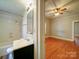 This bathroom connects to the bedroom and features a shower-tub combo at 318 Chestnut Ave, Kannapolis, NC 28081