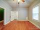 Cozy bedroom with hardwood floors and a doorway leading to another room at 318 Chestnut Ave, Kannapolis, NC 28081