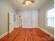 Spacious bedroom with natural light, hardwood flooring, and built-in closet at 318 Chestnut Ave, Kannapolis, NC 28081