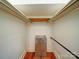 Small closet with shelving, rod, and hardwood flooring at 318 Chestnut Ave, Kannapolis, NC 28081