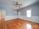 A bright living room featuring hardwood floors, fresh paint, and a ceiling fan at 318 Chestnut Ave, Kannapolis, NC 28081