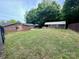Large backyard with a covered patio and storage shed, perfect for outdoor activities at 35 Caldwell Dr, Taylorsville, NC 28681