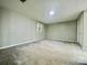 Spacious bedroom with neutral walls and carpet flooring at 35 Caldwell Dr, Taylorsville, NC 28681