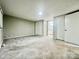 Spacious bedroom featuring neutral walls, carpeted floors, and ample closet space for storage at 35 Caldwell Dr, Taylorsville, NC 28681