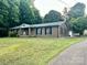 Charming brick ranch home with a well-manicured lawn and inviting front porch at 35 Caldwell Dr, Taylorsville, NC 28681