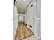 Hallway featuring laminate flooring and paneled walls at 35 Caldwell Dr, Taylorsville, NC 28681