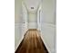 Hallway featuring wood floors and white wainscoting at 35 Caldwell Dr, Taylorsville, NC 28681