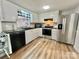 Bright kitchen featuring stainless steel appliances and white cabinets at 35 Caldwell Dr, Taylorsville, NC 28681
