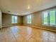 Spacious living room featuring tile floors, natural light, and neutral wall color at 35 Caldwell Dr, Taylorsville, NC 28681