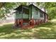 Backyard with a well-maintained lawn and the home's green exterior at 401 7Th St, Spencer, NC 28159