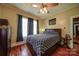 Comfortable bedroom has hardwood floors, natural light and unique ceiling fan at 401 7Th St, Spencer, NC 28159