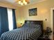 Bedroom boasts hardwood floors, natural light and unique ceiling fan with light at 401 7Th St, Spencer, NC 28159