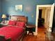 Charming bedroom with hardwood floors and an entryway to another room at 401 7Th St, Spencer, NC 28159