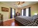 Bedroom boasts hardwood floors, natural light and unique ceiling fan with light at 401 7Th St, Spencer, NC 28159