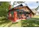 Charming home with a colorful exterior, inviting front porch, and convenient carport at 401 7Th St, Spencer, NC 28159