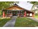 Charming home with a colorful exterior, inviting front porch, and convenient carport at 401 7Th St, Spencer, NC 28159