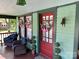 Inviting front porch with comfortable seating and decorative accents, perfect for relaxing at 401 7Th St, Spencer, NC 28159