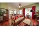 Ornate living room with vintage furnishings and hardwood floors at 401 7Th St, Spencer, NC 28159