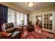 Inviting living room features hardwood floors, large windows and stylish seating at 401 7Th St, Spencer, NC 28159