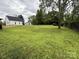 Expansive backyard featuring a lush lawn with tree providing shade and privacy at 405 Jose St, Shelby, NC 28150