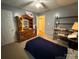 Bedroom featuring a mirrored dresser, black shelving, and a single bed at 405 Jose St, Shelby, NC 28150